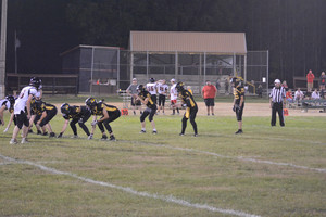 Elcho's Brandon Siemers and Kaleb Eighmy and the Wolverines' line set up a play during a match against Bowler on Friday, September 9.
